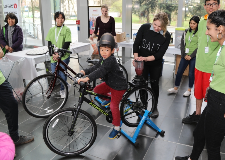 child pedaling bike to make smoothie