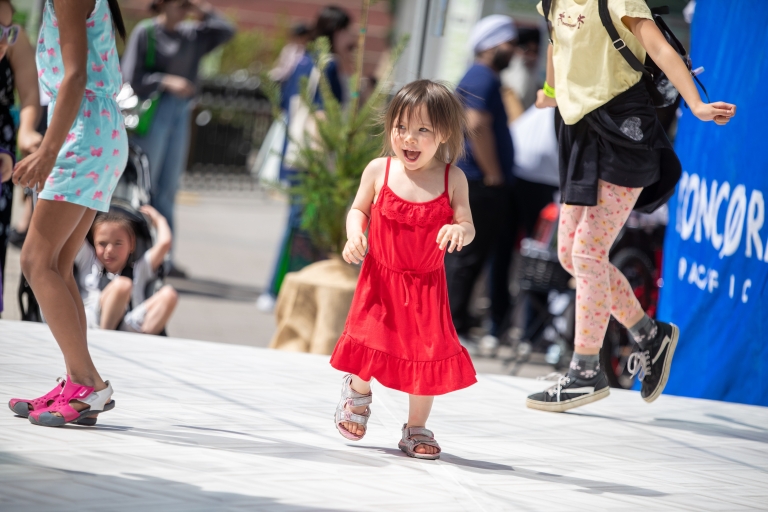 kid smiling at surrey civic plaza