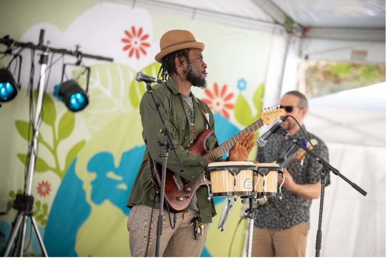 Musician plays bongos on stage