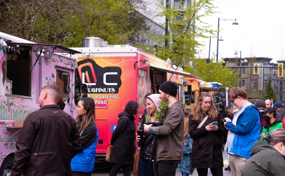 People at food trucks waiting for order